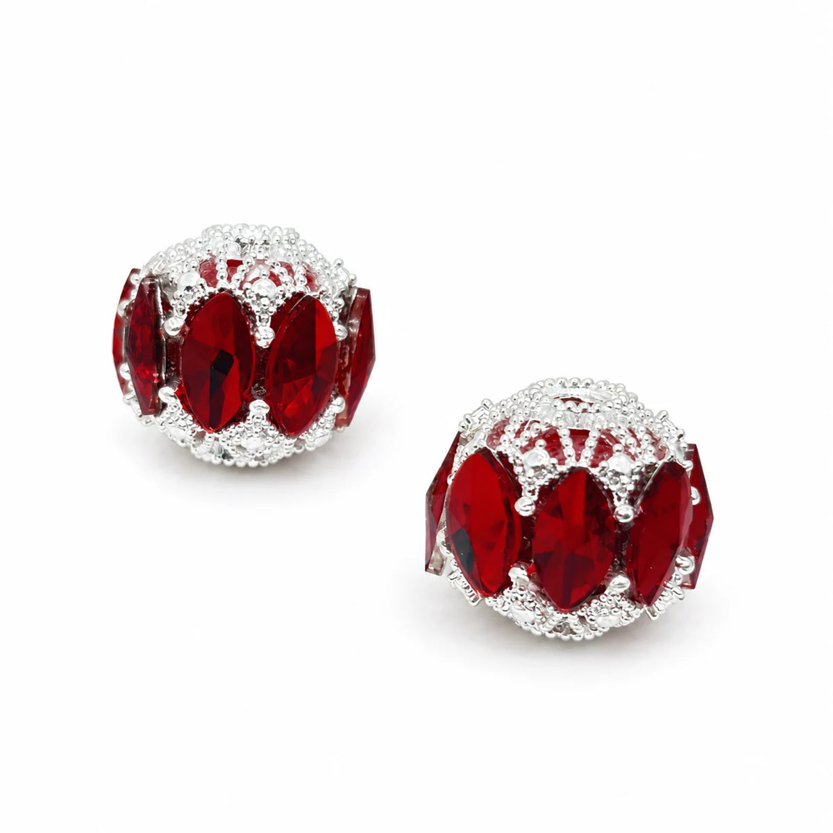 Red filigree focal beads with marquise-shaped accents and silver-tone detailing